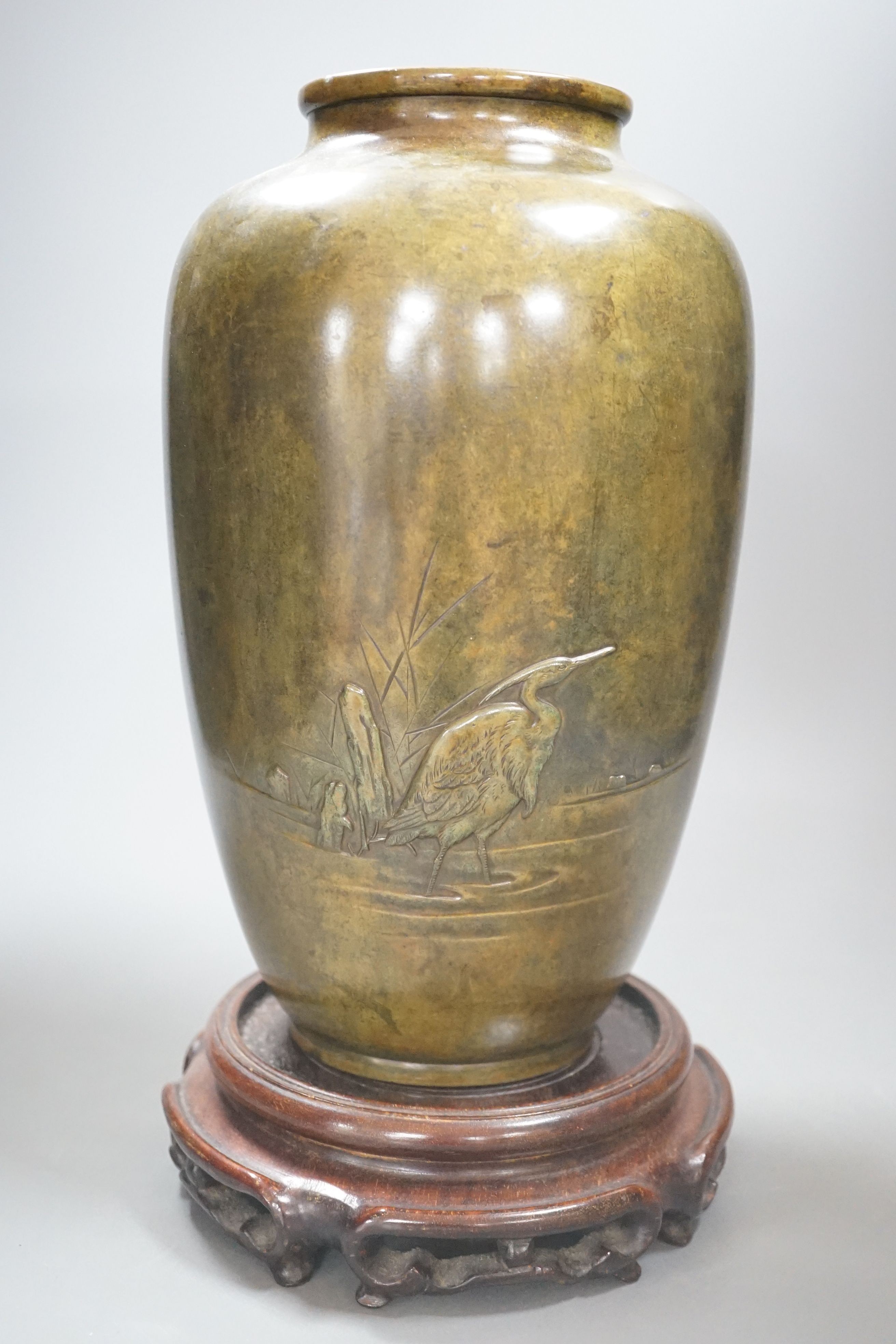 A Japanese Meiji period bronze vase, wood stand - 35cm tall